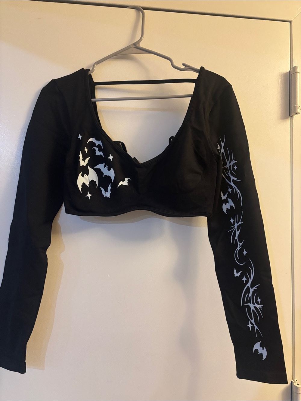 Black Long-Sleeve Crop Top with Bat Graphic